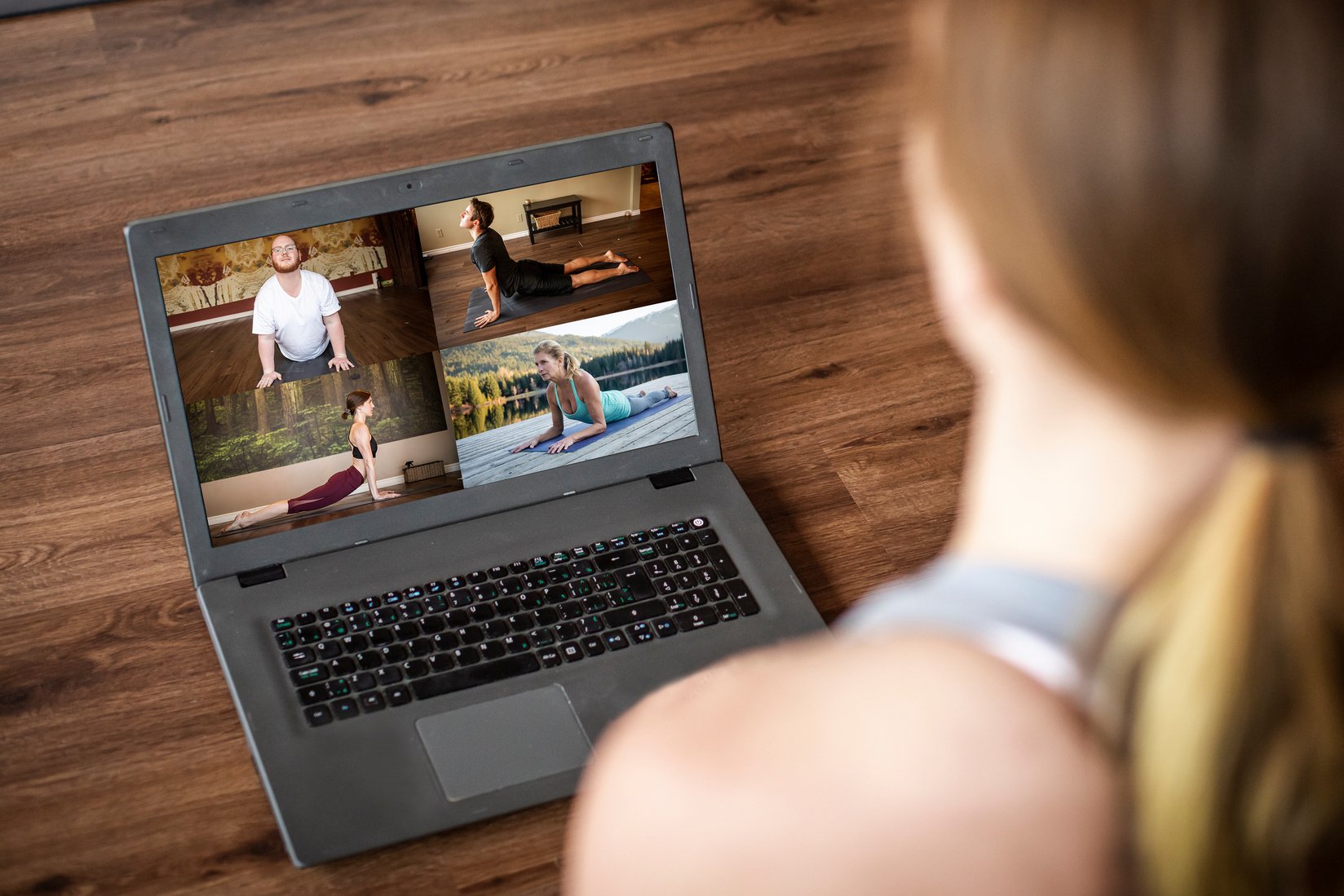 Yoga instructor teaching online class from studio.